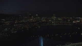AX155_326 - 5.5K aerial stock footage approaching Marquam Bridge and the Downtown Portland city skyline at night, Oregon