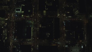 AX155_340 - 5.5K stock footage aerial video of a bird's eye of city streets at night through Downtown Portland, Oregon, reveal I-405 and SW Broadway