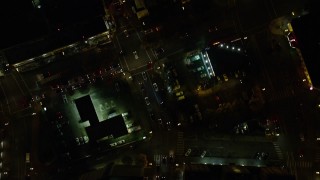 AX155_346E - 5.5K aerial stock footage of a bird's eye of NW 4th and 5th Avenue through downtown at nighttime; Downtown Portland, Oregon