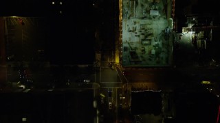 AX155_354E - 5.5K aerial stock footage of a bird's eye of SW Broadway and Pioneer Courthouse Square at night in Downtown Portland, Oregon