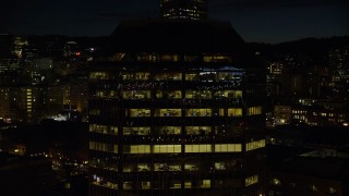 AX155_369 - 5.5K aerial stock footage flying by One Pacific Square at night, Downtown Portland, Oregon
