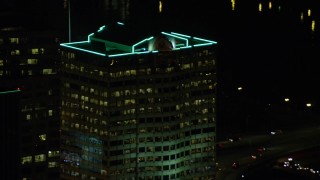 AX155_383 - 5.5K aerial stock footage tracking Bank of America Financial Center at night in Downtown Portland, Oregon