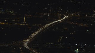 AX155_411 - 5.5K aerial stock footage of heavy traffic congestion on the Fremont Bridge at night in Downtown Portland, Oregon