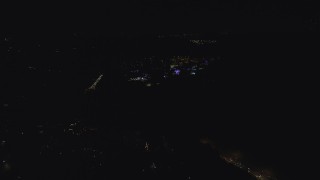 AX155_438 - 5.5K stock footage aerial video approaching the Oregon Zoo with holiday lights at night, Southwest Portland, Oregon