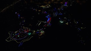 AX155_438E - 5.5K aerial stock footage approaching the Oregon Zoo with holiday lights at night, Southwest Portland, Oregon