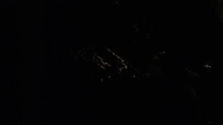 AX155_441 - 5.5K aerial stock footage of a suburban home at night decorated for Christmas, Southwest Portland, Oregon