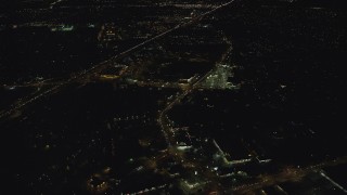 AX155_446 - 5.5K aerial stock footage approaching strip malls by Highway 26 at night, Beaverton, Oregon