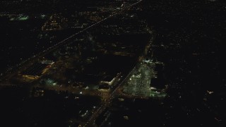 AX155_447 - 5.5K aerial stock footage flying over strip mall by Highway 26 at night to approach neighborhood, Beaverton, Oregon