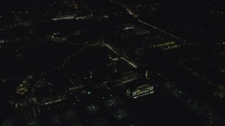 AX155_449 - 5.5K aerial stock footage flying by the Nike Headquarters office buildings at night, Beaverton, Oregon