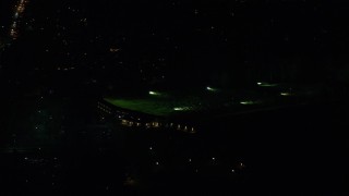 AX155_461 - 5.5K aerial stock footage flying by Red Tail Golf Center at night, Beaverton, Oregon