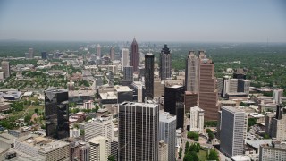 AX36_004E - 4.8K aerial stock footage flying over office buildings near skyscrapers, Downtown Atlanta, Georgia