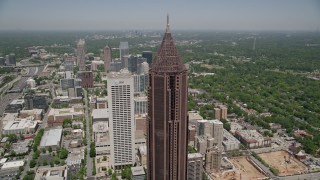 AX36_040E - 4.8K aerial stock footage flying by SunTrust Plaza to approach Bank of America Plaza, Midtown Atlanta