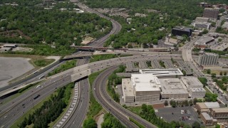 AX36_045E - 4.8K aerial stock footage panning across freeways and expressways to reveal office buildings, Buckhead, Georgia