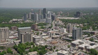 AX36_054E - 4.8K aerial stock footage tilt from Peachtree Road to reveal high-rises and skyscrapers, Buckhead, Georgia