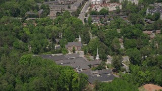 AX36_056 - 4.8K aerial stock footage approaching a church nestled among trees, Buckhead, Georgia 
