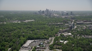 AX36_081 - 4.8K aerial stock footage tilting up from Peachtree Road to reveal Midtown Atlanta skyscrapers, Georgia
