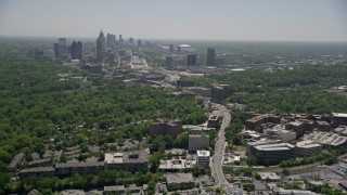AX36_082E - 4.8K aerial stock footage following Peachtree Road toward Midtown Atlanta skyline; Buckhead, Georgia