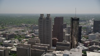 AX36_093E - 4.8K aerial stock footage flying by SunTrust Plaza reavealing skyscrapers and hotel, Downtown Atlanta