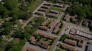 AX37_003 - 4.8K stock footage aerial video flying over abandoned residential buildings, West Atlanta