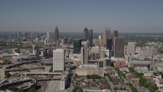 AX37_011E - 4.8K aerial stock footage approaching Downtown skyscrapers with Midtown Atlanta in the distance, Georgia