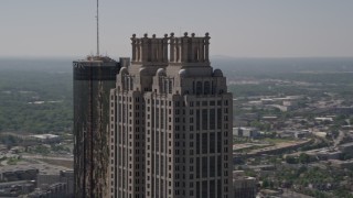 AX37_015 - 4.8K aerial stock footage orbiting the top of 191 Peachtree Tower, Downtown Atlanta