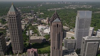 AX37_018E - 4.8K aerial stock footage flying over GLG Grand and tilt to bird's eye view of Promenade II, Midtown Atlanta, Georgia