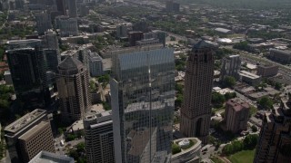 AX37_024E - 4.8K aerial stock footage approach and tilt to bird's eye view of 1180 Peachtree skyscraper, Midtown Atlanta, Georgia