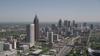 AX37_042 - 4.8K aerial stock footage flying by Midtown Atlanta skyscrapers toward Downtown skyscrapers, Georgia