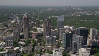 AX37_069 - 4.8K aerial stock footage flying by Midtown Atlanta skyscrapers, Georgia