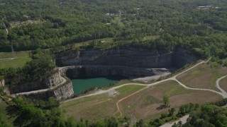 AX37_088 - 4.8K aerial stock footage flying by a quarry, Atlanta, Georgia