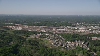 AX38_004 - 4.8K aerial stock footage approaching a train yard, Atlanta, Georgia