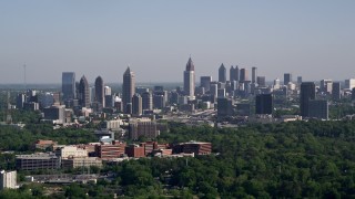 AX38_030E - 4.8K aerial stock footage of the Midtown and Downtown Atlanta skyline seen from Buckhead, Georgia