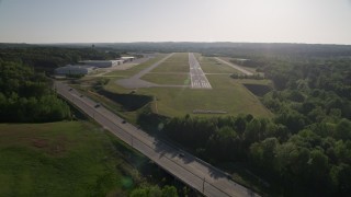 AX38_085 - 4.8K aerial stock footage approaching a runway, Fulton County Airport, Georgia