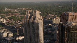 AX39_005 - 4.8K aerial stock footage flying by Westin Peachtree Plaza Hotel and 191 Peachtree Tower, Downtown Atlanta