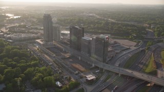 AX39_024 - 4.8K aerial stock footage flying away from office buildings and The Atlantic apartments, Midtown Atlanta