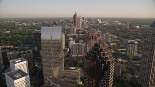 AX39_057E - 4.8K aerial stock footage orbiting Promenade II, revealing cluster of skyscrapers, Midtown Atlanta