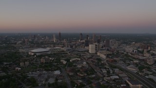AX40_001 - 4.8K aerial stock footage of Downtown, Midtown and Georgia Dome, Atlanta, twilight