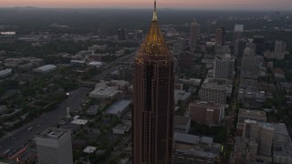 AX40_006E - 4.8K aerial stock footage approach and orbit Bank of America Plaza, Midtown Atlanta, Georgia, twilight
