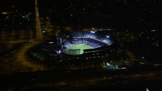 AX41_002E - 4.8K aerial stock footage approach Turner Field, tilt to bird's eye view, Atlanta, Georgia, night