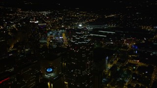 AX41_017E - 4.8K aerial stock footage orbiting SunTrust Plaza revealing nearby skyscrapers, Downtown Atlanta, night