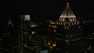 AX41_028E - 4.8K stock footage aerial video flyby and orbit skyscrapers around One Atlantic Center, Midtown Atlanta, Georgia, night