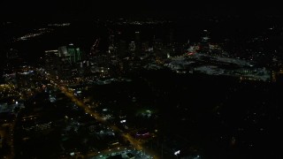 AX41_040E - 4.8K aerial stock footage approaching skyscrapers and Piedmont Road, Buckhead, Georgia, night