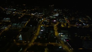 AX41_052 - 4.8K aerial stock footage following city streets revealing city sprawl, Buckhead, Georgia, night
