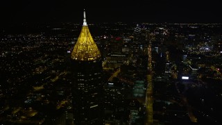 AX41_057E - 4.8K aerial stock footage flying by Bank of American Plaza toward Downtown, Midtown Atlanta, night