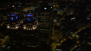 AX41_060E - 4.8K aerial stock footage flying over and between skyscrapers revealing State Capitol, Downtown Atlanta, Georgia, night