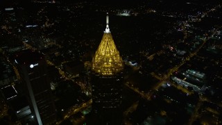 AX41_068E - 4.8K aerial stock footage tilting from black sky to reveal Bank of America Plaza, Midtown Atlanta, night