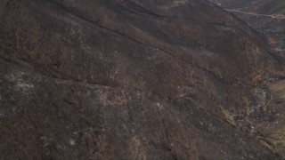 AX42_002 - 5K aerial stock footage fly over scorched slopes of the Santa Monica Mountains, California