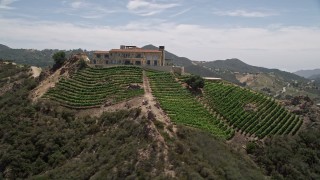 AX42_109 - 5K aerial stock footage of the scenic Malibu Rocky Oaks Estate Vineyards and hillside grapevines, Malibu, California