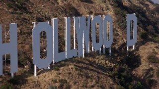 AX43_002 - 4K aerial stock footage of a slow, close flyby of the Hollywood Sign, Los Angeles, California