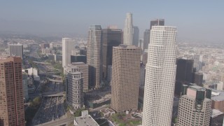 AX43_023 - 4K aerial stock footage flying by the tall skyscrapers of Downtown Los Angeles, California